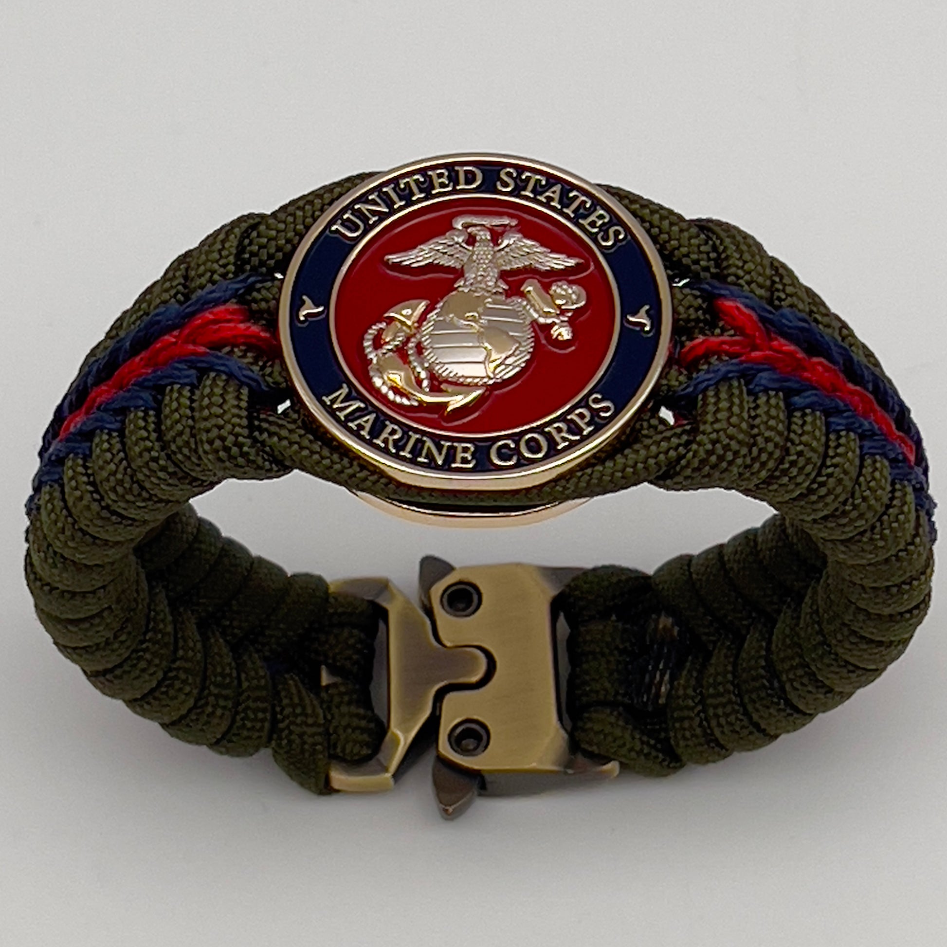 Thick, semi-rigid and comfortable braided United States Marine Corps bracelet featuring a 24K gold and silver plated USMC officer Eagle Globe and Anchor medallion, a gold Cobra style tactical buckle and woven with olive drab 550 and Imperial red and gold micro paracord.