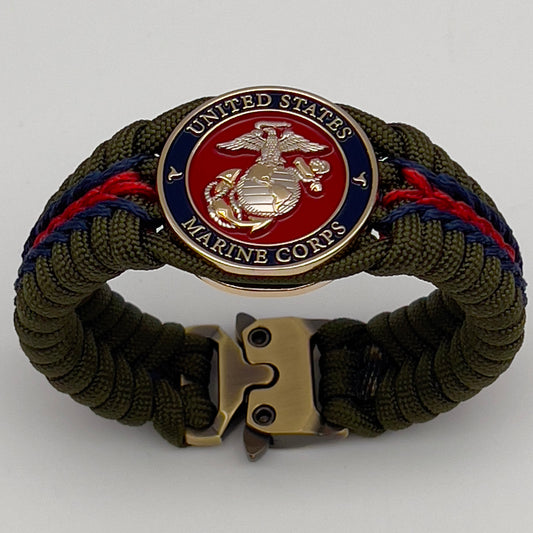 Thick, semi-rigid and comfortable braided United States Marine Corps bracelet featuring a 24K gold and silver plated USMC officer Eagle Globe and Anchor medallion, a gold Cobra style tactical buckle and woven with olive drab 550 and Imperial red and gold micro paracord.