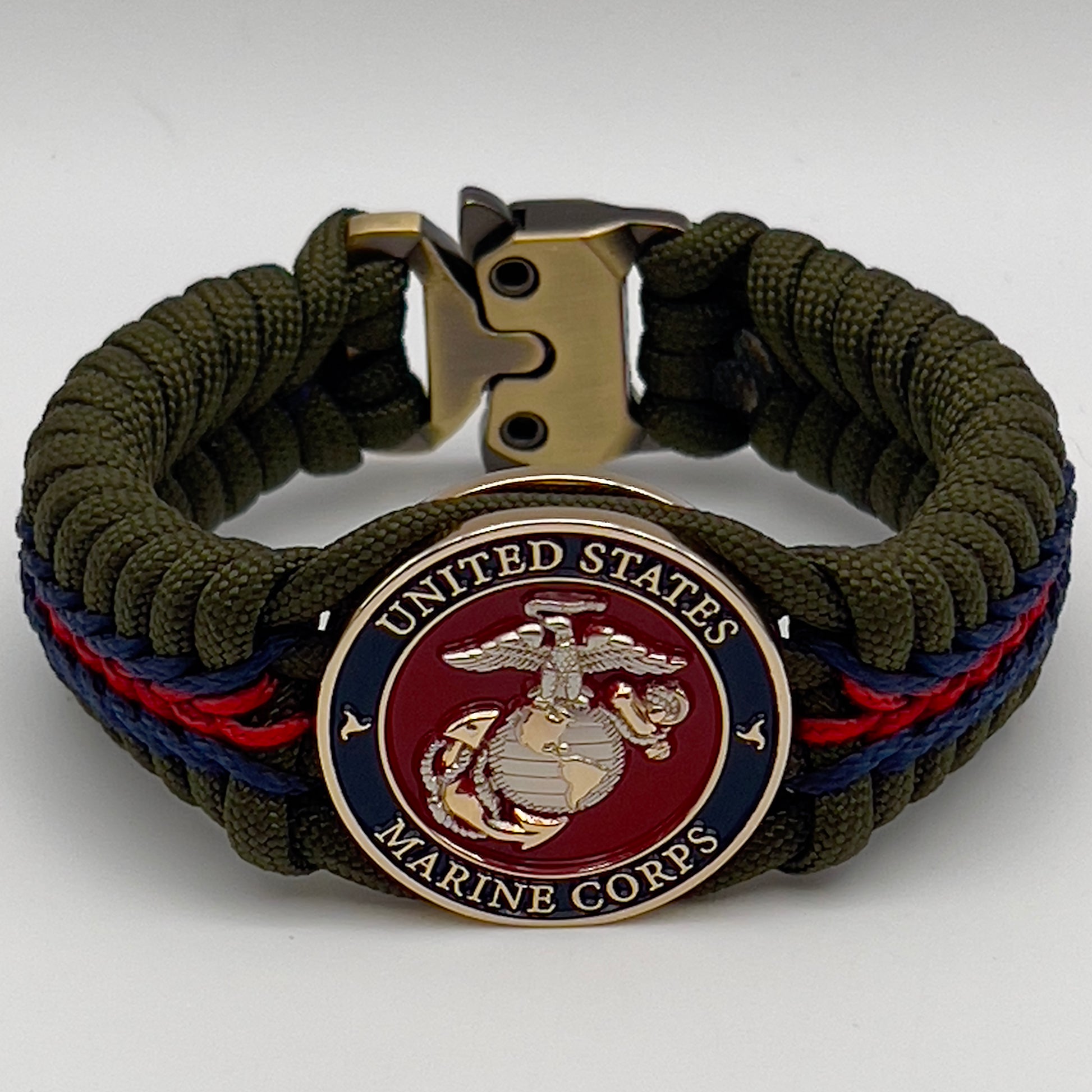 Thick, semi-rigid and comfortable braided United States Marine Corps bracelet featuring a 24K gold and silver plated USMC officer Eagle Globe and Anchor medallion, a gold Cobra style tactical buckle and woven with olive drab 550 and Imperial red and gold micro paracord.