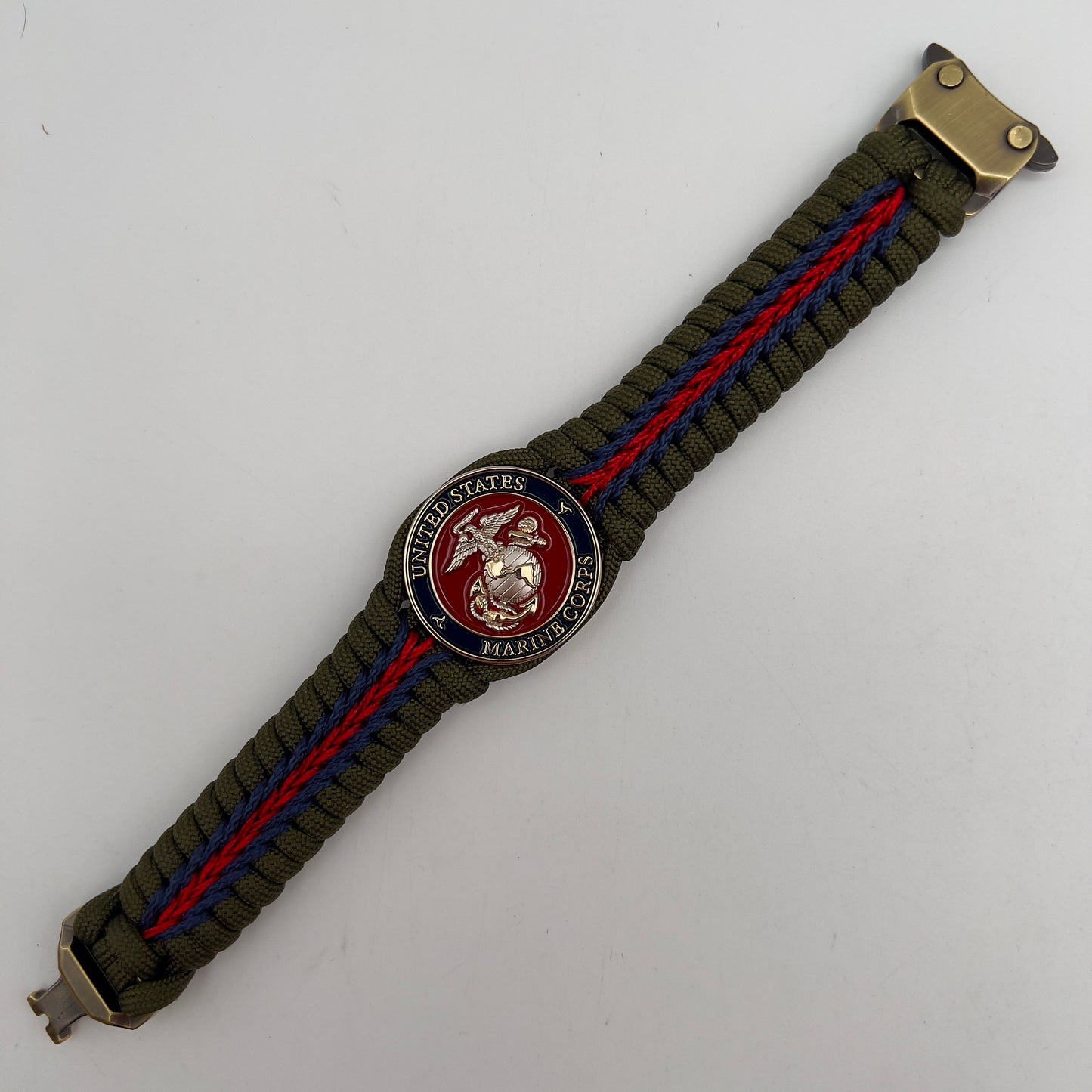 Thick, semi-rigid and comfortable braided United States Marine Corps bracelet featuring a 24K gold and silver plated USMC officer Eagle Globe and Anchor medallion, a gold Cobra style tactical buckle and woven with olive drab 550 and Imperial red and gold micro paracord.