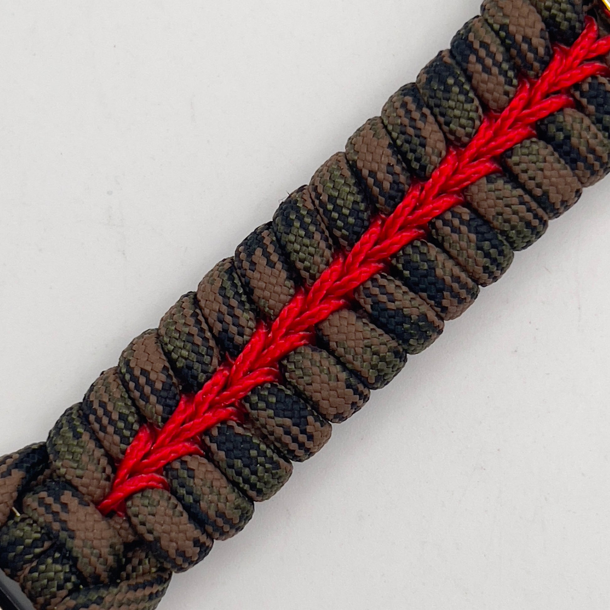 Thick, semi-rigid and comfortable braided United States Marine Corps bracelet featuring a 24K gold and silver plated USMC officer Eagle Globe and Anchor medallion, a gold Cobra style tactical buckle and woven with Woodland Camo 550 paracord and Imperial Red micro cord.