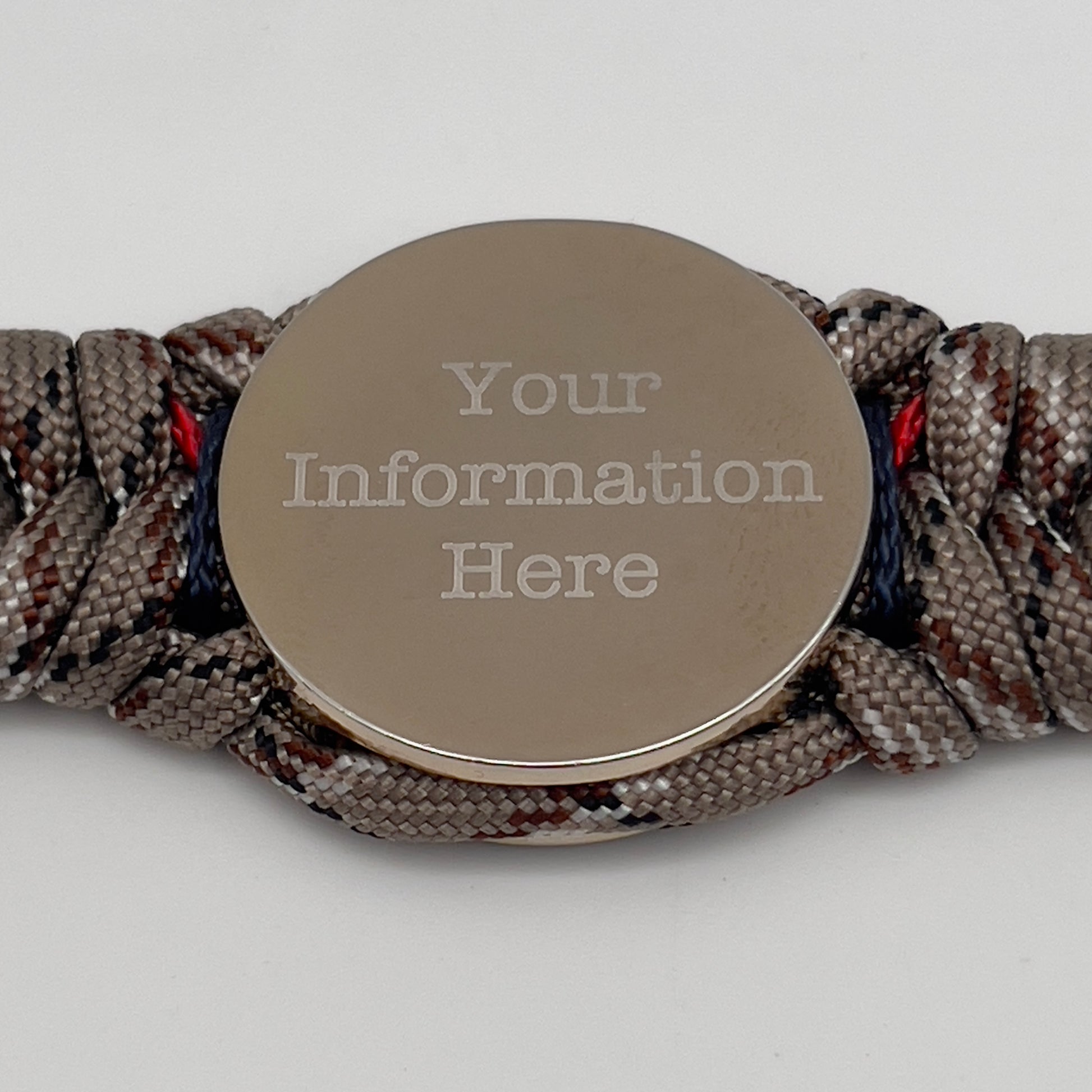 Thick and comfortable braided United States Marine Corps bracelet featuring a 24K gold and silver plated USMC officer Eagle Globe and Anchor medallion, a Cobra style tactical buckle and woven with Desert Camo 550 paracord and Imperial red and Navy Blue micro cord.