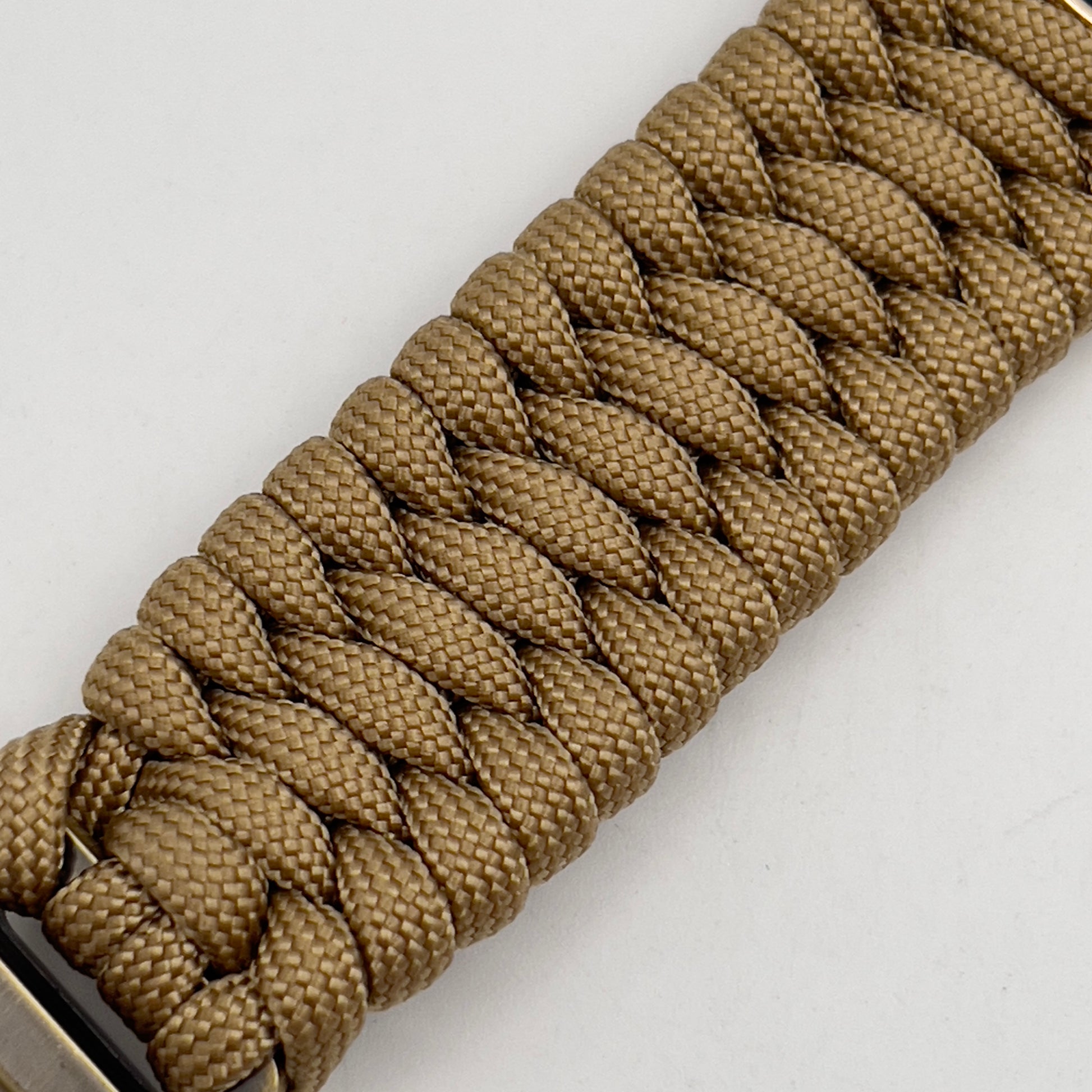 Thick and comfortable braided United States Marine Corps bracelet featuring a 24K gold and silver plated USMC officer Eagle Globe and Anchor medallion, a Cobra style tactical buckle and woven with gold 550 paracord.