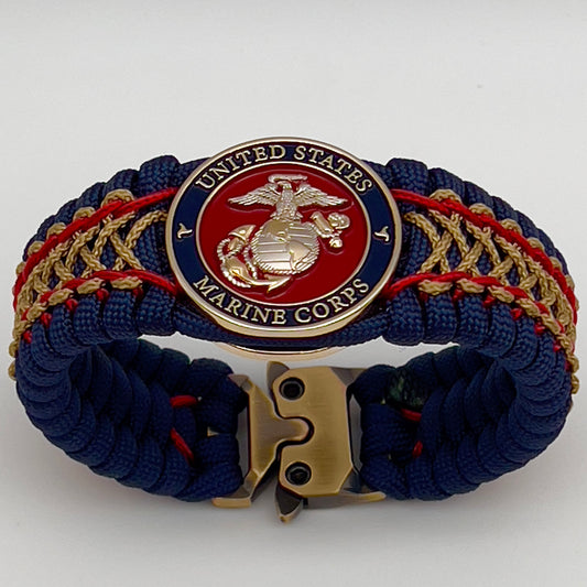 Thick and comfortable braided United States Marine Corps bracelet featuring a 24K gold and silver plated USMC officer Eagle Globe and Anchor medallion, a Cobra style tactical buckle and woven with gold 550 paracord and Imperial Red and Gold micro cord.