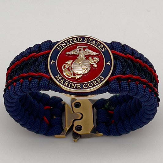 Thick and comfortable braided United States Marine Corps bracelet featuring a 24K gold and silver plated USMC officer Eagle Globe and Anchor medallion, a Cobra style tactical buckle and woven with gold 550 paracord and Imperial Red and Black micro cord.
