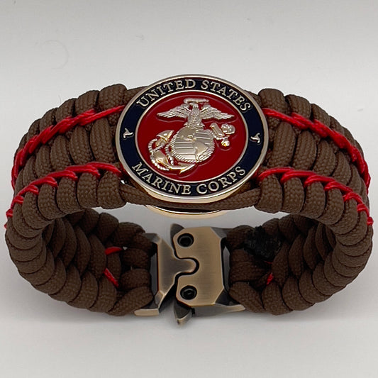 Thick and comfortable braided United States Marine Corps bracelet featuring a 24K gold and silver plated USMC officer Eagle Globe and Anchor medallion, a Cobra style tactical buckle and woven with Coyote Brown 550 paracord and Imperial Red micro cord.