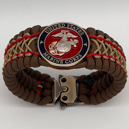 Thick and comfortable braided United States Marine Corps bracelet featuring a 24K gold and silver plated USMC officer Eagle Globe and Anchor medallion, a Cobra style tactical buckle and woven with Coyote Brown 550 paracord and Imperial Red and gold micro cord.