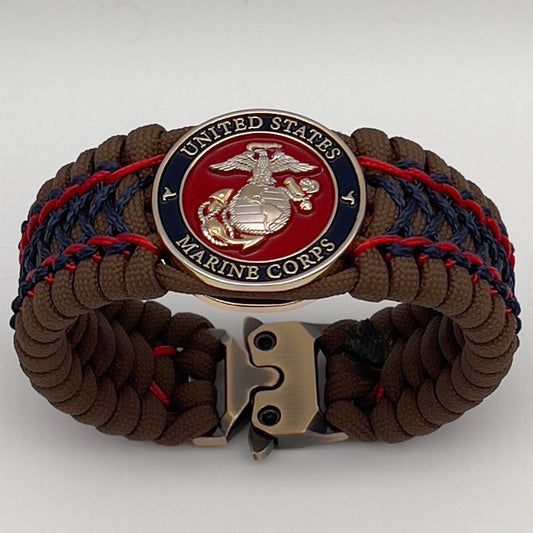 Thick and comfortable braided United States Marine Corps bracelet featuring a 24K gold and silver plated USMC officer Eagle Globe and Anchor medallion, a Cobra style tactical buckle and woven with Coyote Brown 550 paracord and Imperial Red and Navy Blue micro cord.