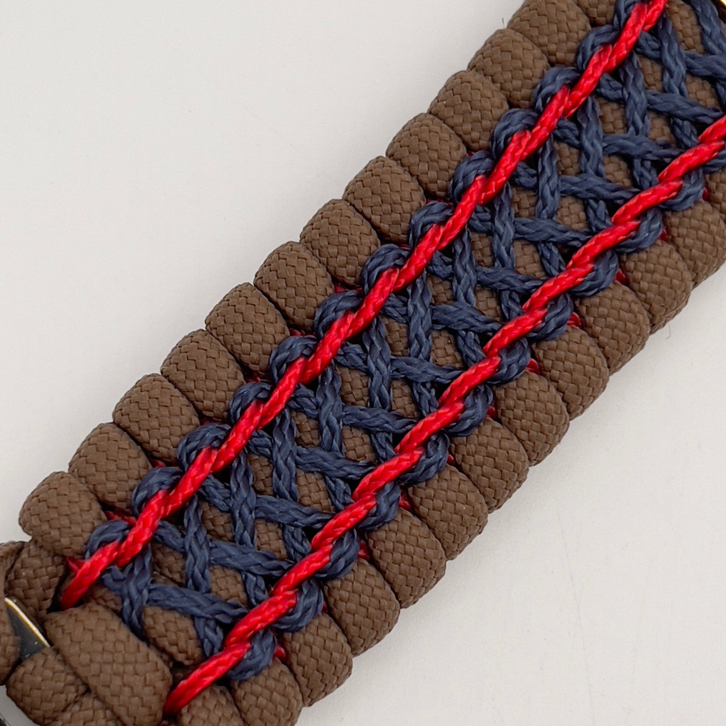Thick and comfortable braided United States Marine Corps bracelet featuring a 24K gold and silver plated USMC officer Eagle Globe and Anchor medallion, a Cobra style tactical buckle and woven with Coyote Brown 550 paracord and Imperial Red and Navy Blue micro cord.