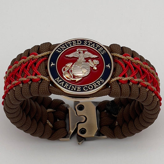 Thick and comfortable braided United States Marine Corps bracelet featuring a 24K gold and silver plated USMC officer Eagle Globe and Anchor medallion, a Cobra style tactical buckle and woven with Coyote Brown 550 paracord and Imperial Red and gold micro cord.
