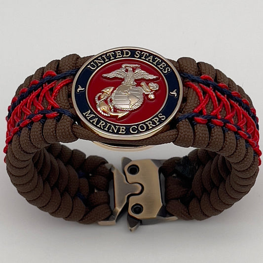 Thick and comfortable braided United States Marine Corps bracelet featuring a 24K gold and silver plated USMC officer Eagle Globe and Anchor medallion, a Cobra style tactical buckle and woven with Coyote Brown 550 paracord and Imperial Red and Navy Blue micro cord.