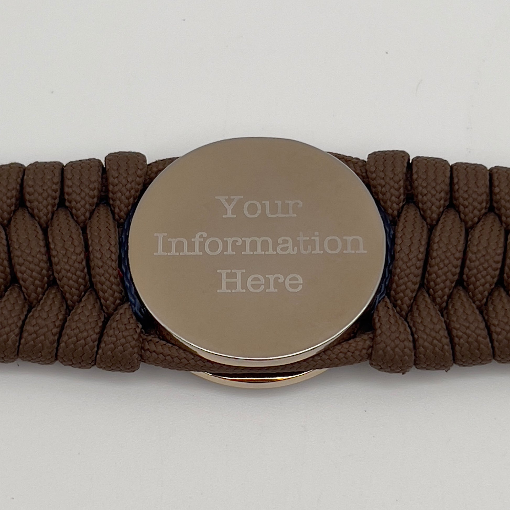 Thick and comfortable braided United States Marine Corps bracelet featuring a 24K gold and silver plated USMC officer Eagle Globe and Anchor medallion, a Cobra style tactical buckle and woven with Coyote Brown 550 paracord and Imperial Red and Navy Blue micro cord.