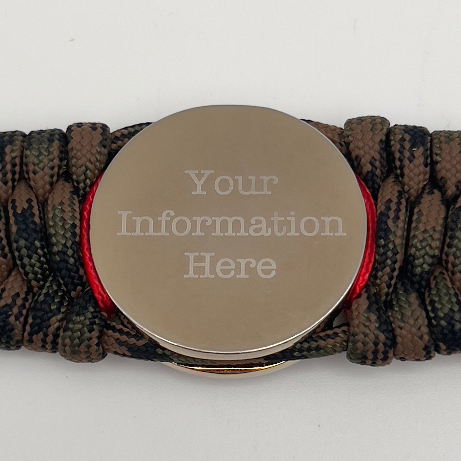 Thick, rigid and comfortable braided United States Marine Corps bracelet featuring a 24K gold and silver plated USMC officer Eagle Globe and Anchor medallion, a gold Cobra style tactical buckle and woven with Woodland Camo 550 paracord and Imperial Red and gold micro cord.