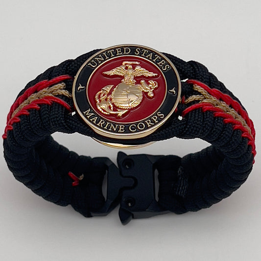 Thick, semi-rigid and comfortable braided United States Marine Corps bracelet featuring a 24K gold and silver plated USMC officer Eagle Globe and Anchor medallion, a black Cobra style tactical buckle and woven with black 550, Imperial red and gold micro paracord.