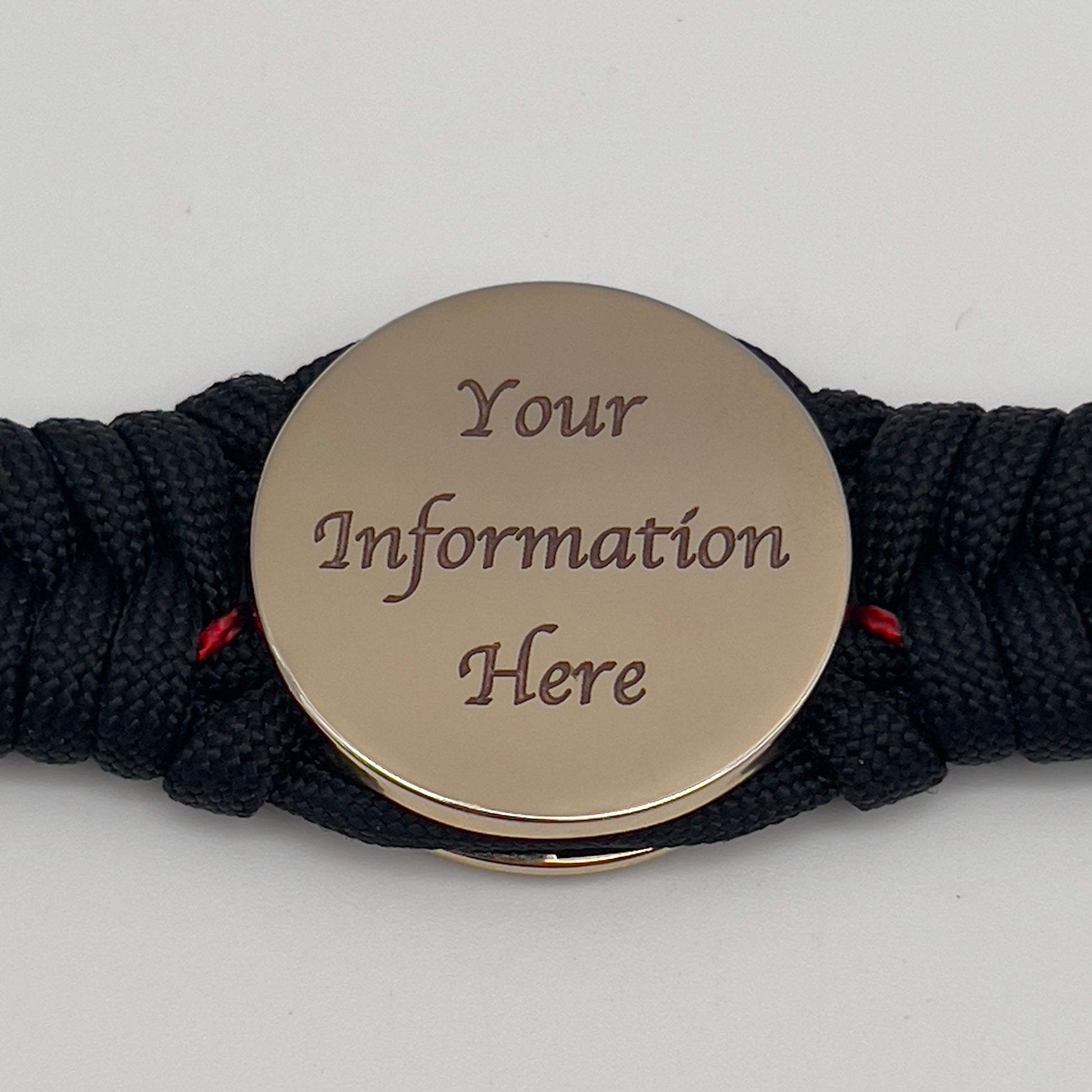 Thick, semi-rigid and comfortable braided United States Marine Corps bracelet featuring a 24K gold plated USMC officer Eagle Globe and Anchor medallion, a black Cobra style tactical buckle and woven with black 550 paracord and Imperial Red micro cord.