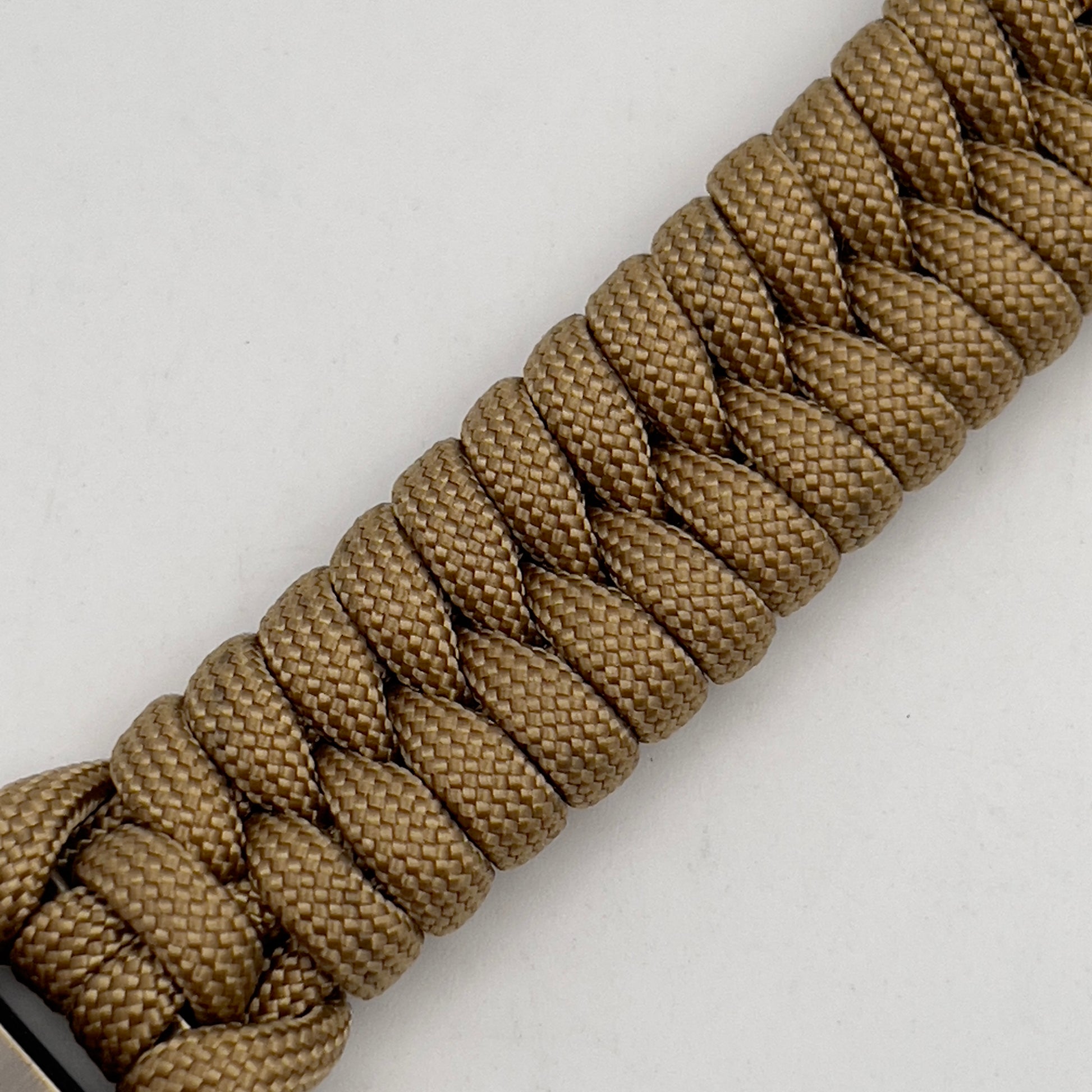 Thick, semi-rigid and comfortable braided United States Marine Corps bracelet featuring a 24K gold plated USMC officer Eagle Globe and Anchor medallion, a gold Cobra style tactical buckle and woven with gold 550 paracord.
