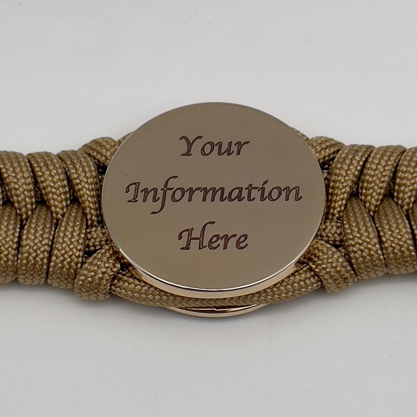 Thick, semi-rigid and comfortable braided United States Marine Corps bracelet featuring a 24K gold plated USMC officer Eagle Globe and Anchor medallion, a gold Cobra style tactical buckle and woven with gold 550 paracord.