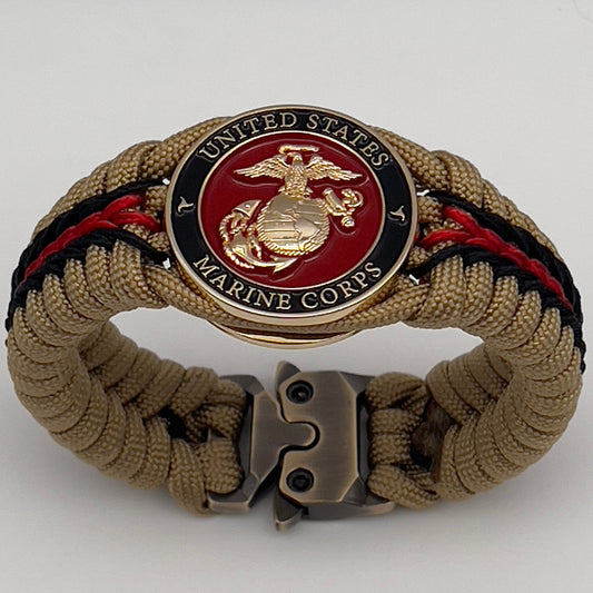 Thick, rigid and comfortable braided United States Marine Corps bracelet featuring a 24K gold plated USMC officer Eagle Globe and Anchor medallion, a gold Cobra style tactical buckle and woven with gold 550 paracord and Imperial Red and black micro cord.