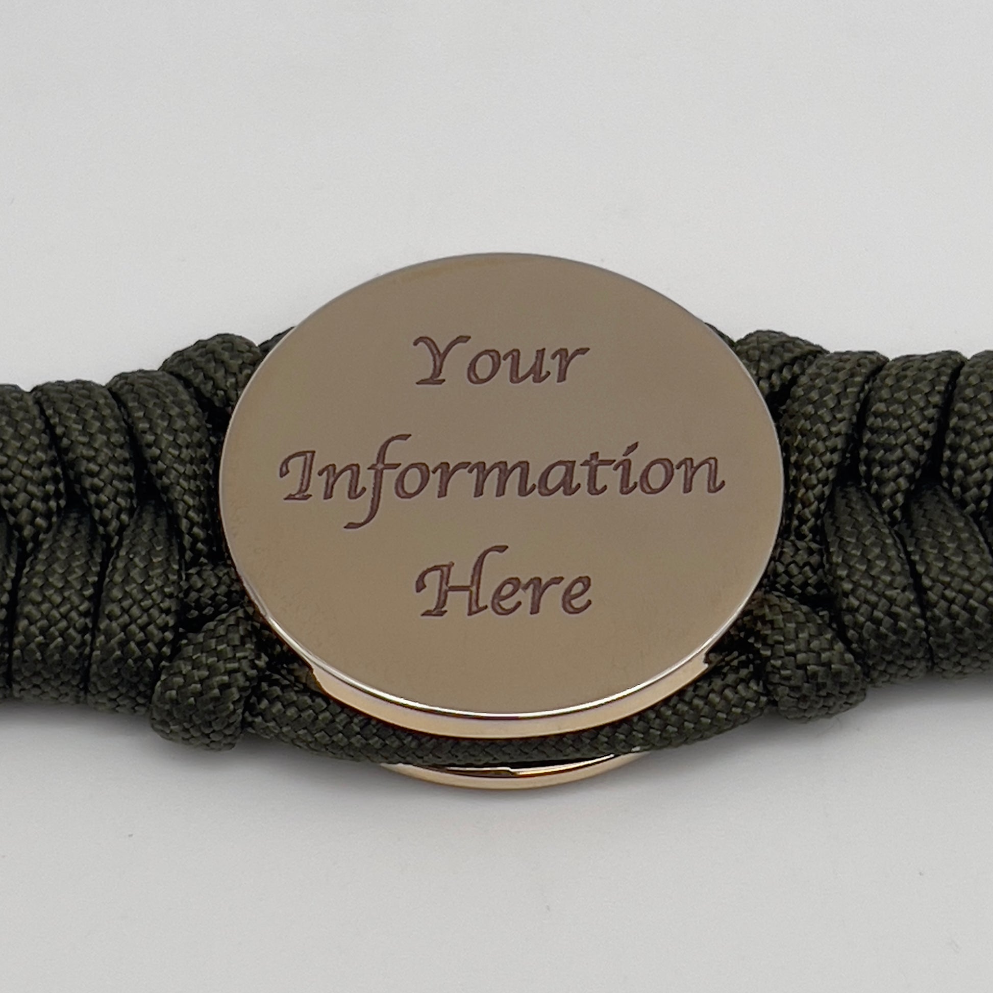 Thick, semi-rigid and comfortable braided United States Marine Corps bracelet featuring a 24K gold plated USMC officer Eagle Globe and Anchor medallion, a gold Cobra style tactical buckle and woven with olive drab 550 paracord.