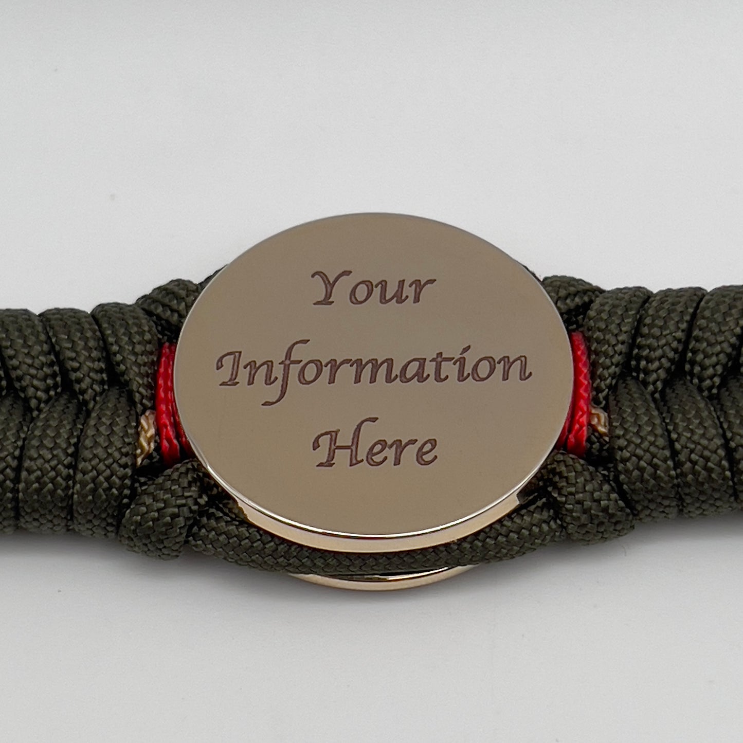 Thick, rigid and comfortable braided United States Marine Corps bracelet featuring a 24K gold plated USMC officer Eagle Globe and Anchor medallion, a gold Cobra style tactical buckle and woven with olive drab 550 paracord and Imperial Red and gold micro cord.