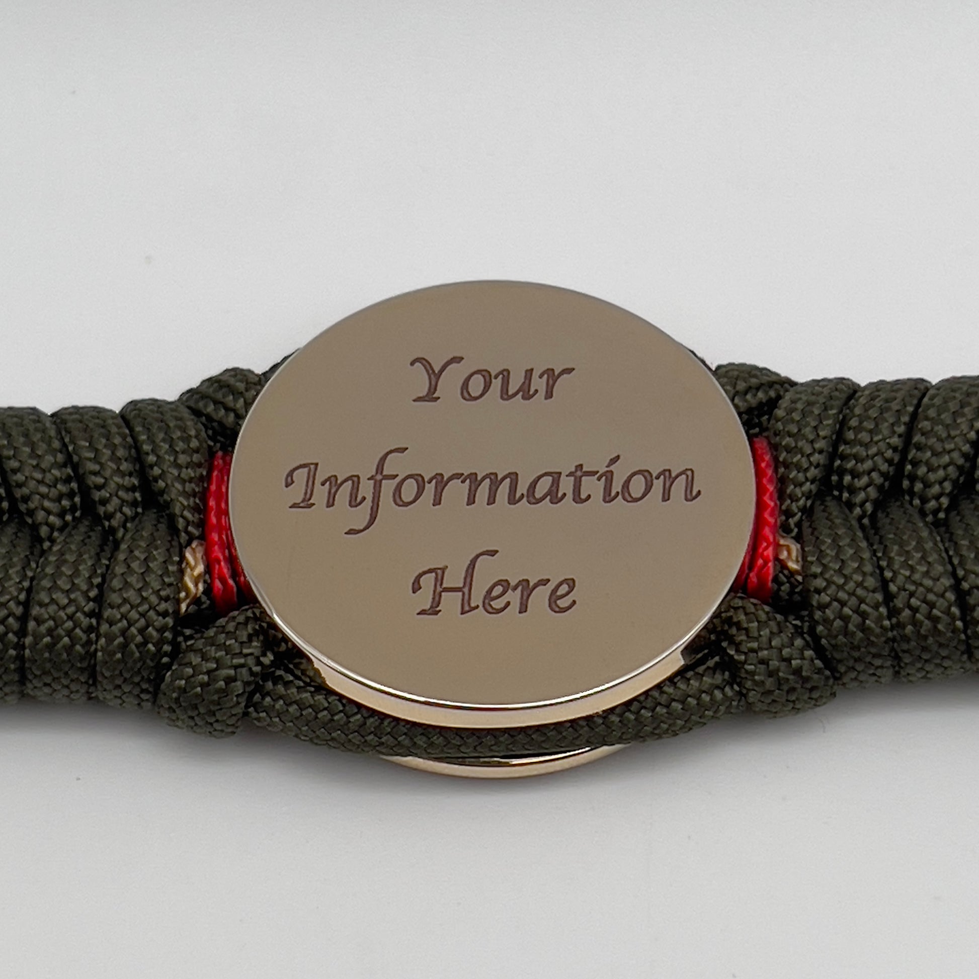 Thick, rigid and comfortable braided United States Marine Corps bracelet featuring a 24K gold plated USMC officer Eagle Globe and Anchor medallion, a gold Cobra style tactical buckle and woven with olive drab 550 paracord and Imperial Red and gold micro cord.