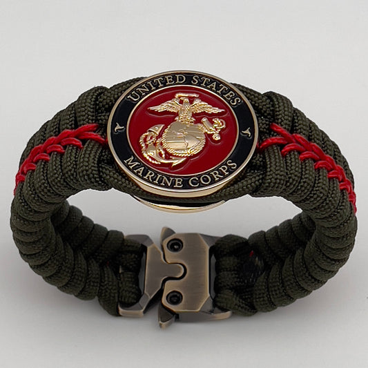 Thick, semi-rigid and comfortable braided United States Marine Corps bracelet featuring a 24K gold plated USMC officer Eagle Globe and Anchor medallion, a gold Cobra style tactical buckle and woven with olive drab 550 paracord and Imperial Red micro cord.