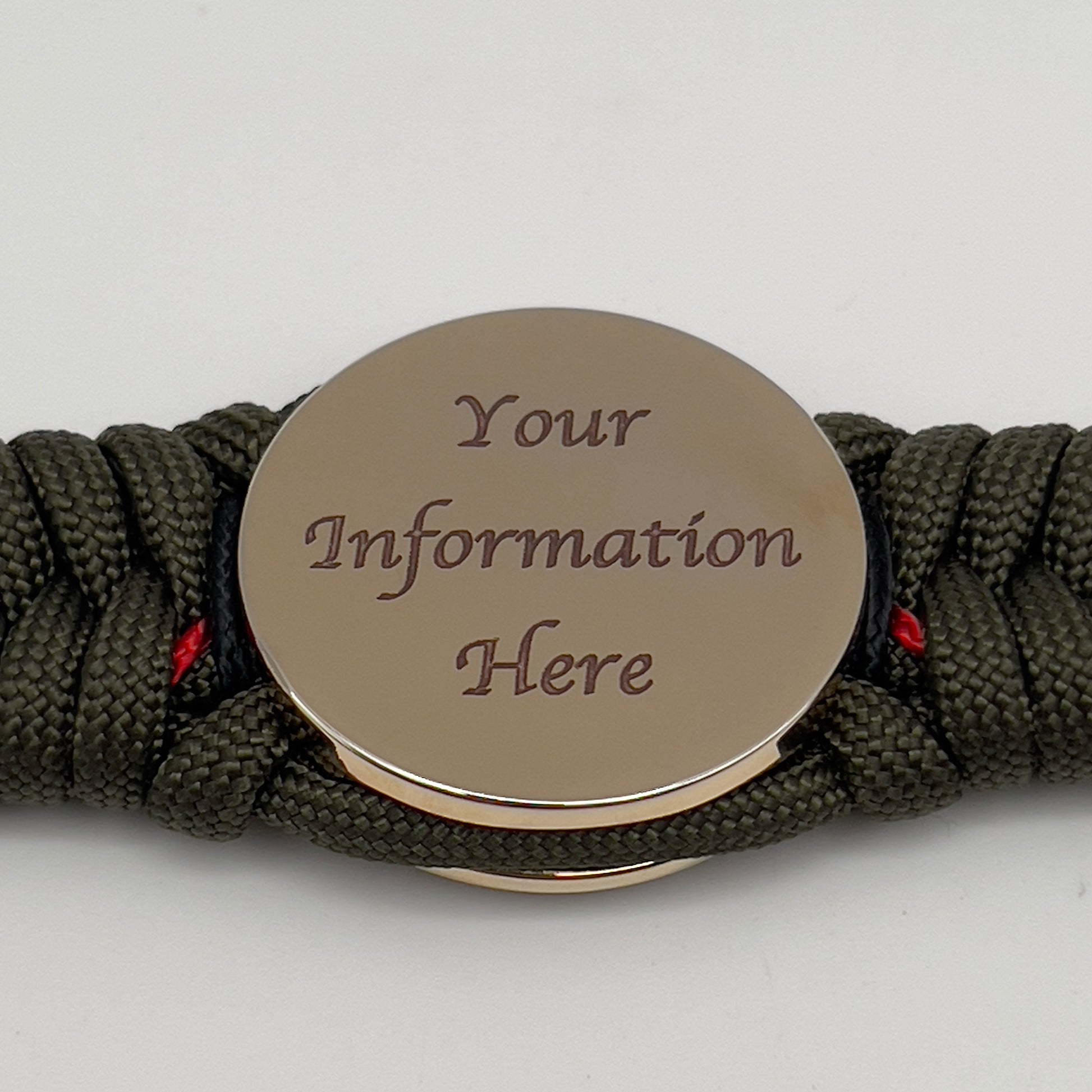 Thick, rigid and comfortable braided United States Marine Corps bracelet featuring a 24K gold plated USMC officer Eagle Globe and Anchor medallion, a gold Cobra style tactical buckle and woven with olive drab 550 paracord and black and Imperial red micro cord.