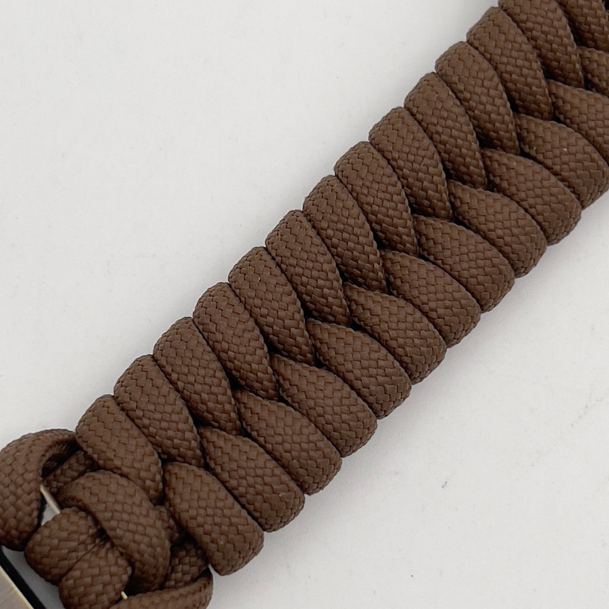 Thick, semi-rigid and comfortable braided United States Marine Corps bracelet featuring a 24K gold plated USMC Eagle Globe and Anchor medallion, a gold Cobra style tactical buckle and woven with Coyote Brown 550 paracord.