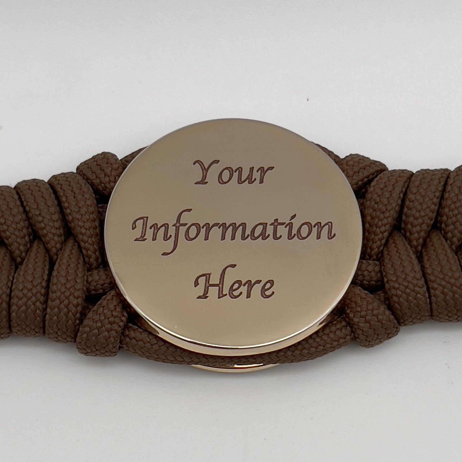 Thick, semi-rigid and comfortable braided United States Marine Corps bracelet featuring a 24K gold plated USMC Eagle Globe and Anchor medallion, a gold Cobra style tactical buckle and woven with Coyote Brown 550 paracord.