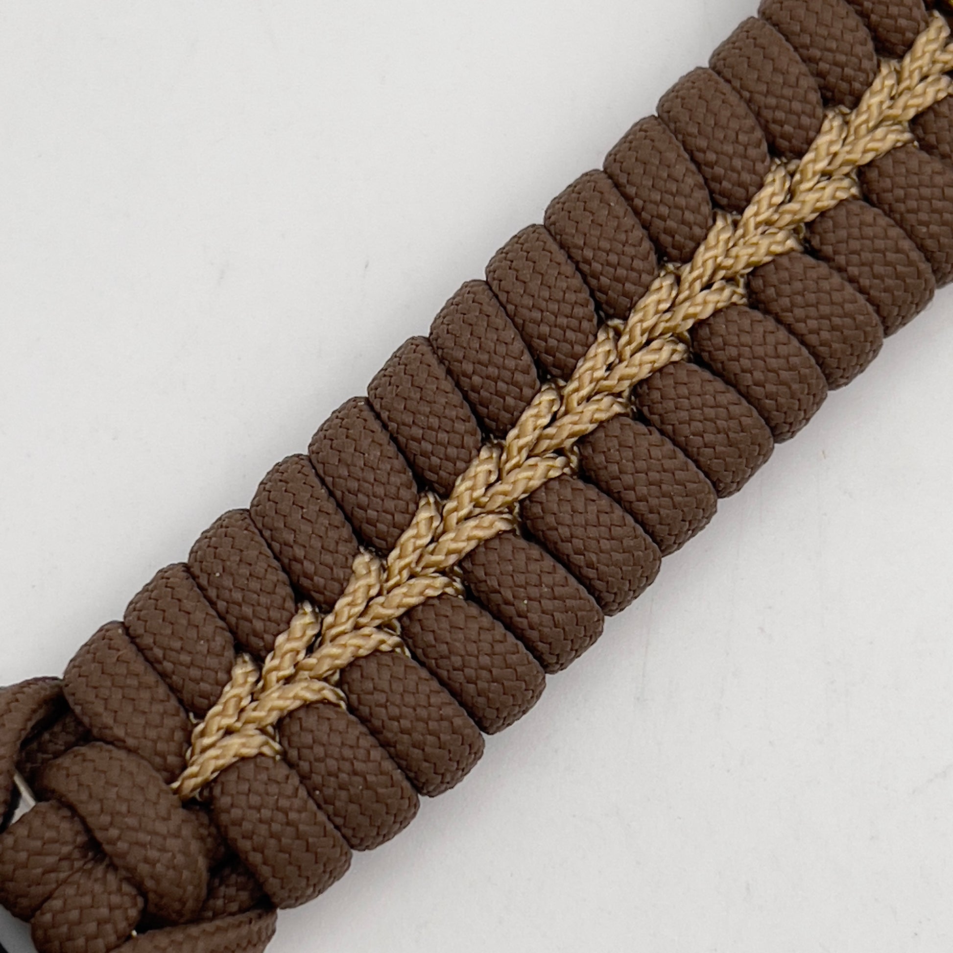 Thick, rigid and comfortable braided United States Marine Corps bracelet featuring a 24K gold plated USMC Eagle Globe and Anchor medallion, a gold Cobra style tactical buckle and woven with Coyote Brown 550 paracord and gold micro cord.