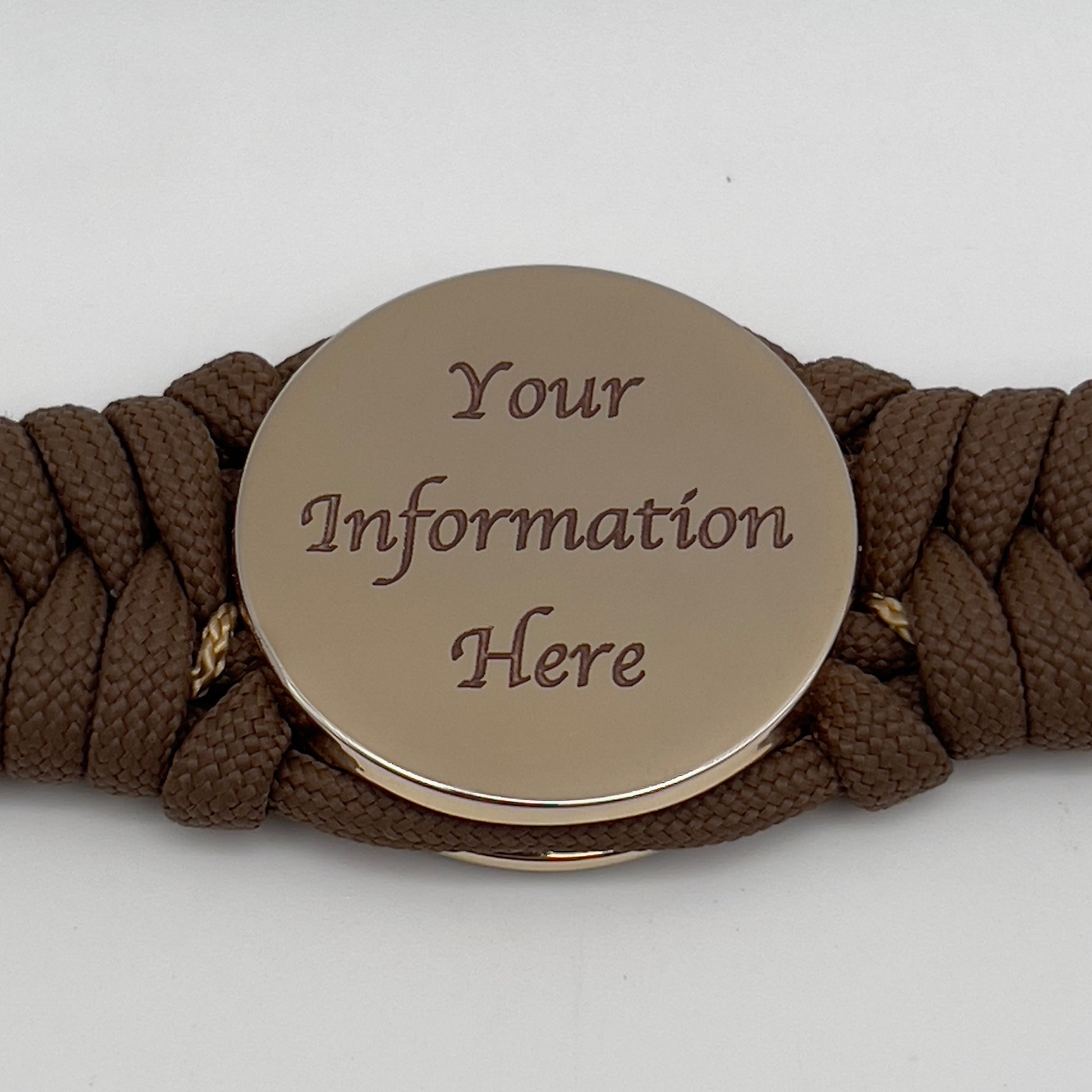 Thick, rigid and comfortable braided United States Marine Corps bracelet featuring a 24K gold plated USMC Eagle Globe and Anchor medallion, a gold Cobra style tactical buckle and woven with Coyote Brown 550 paracord and gold micro cord.