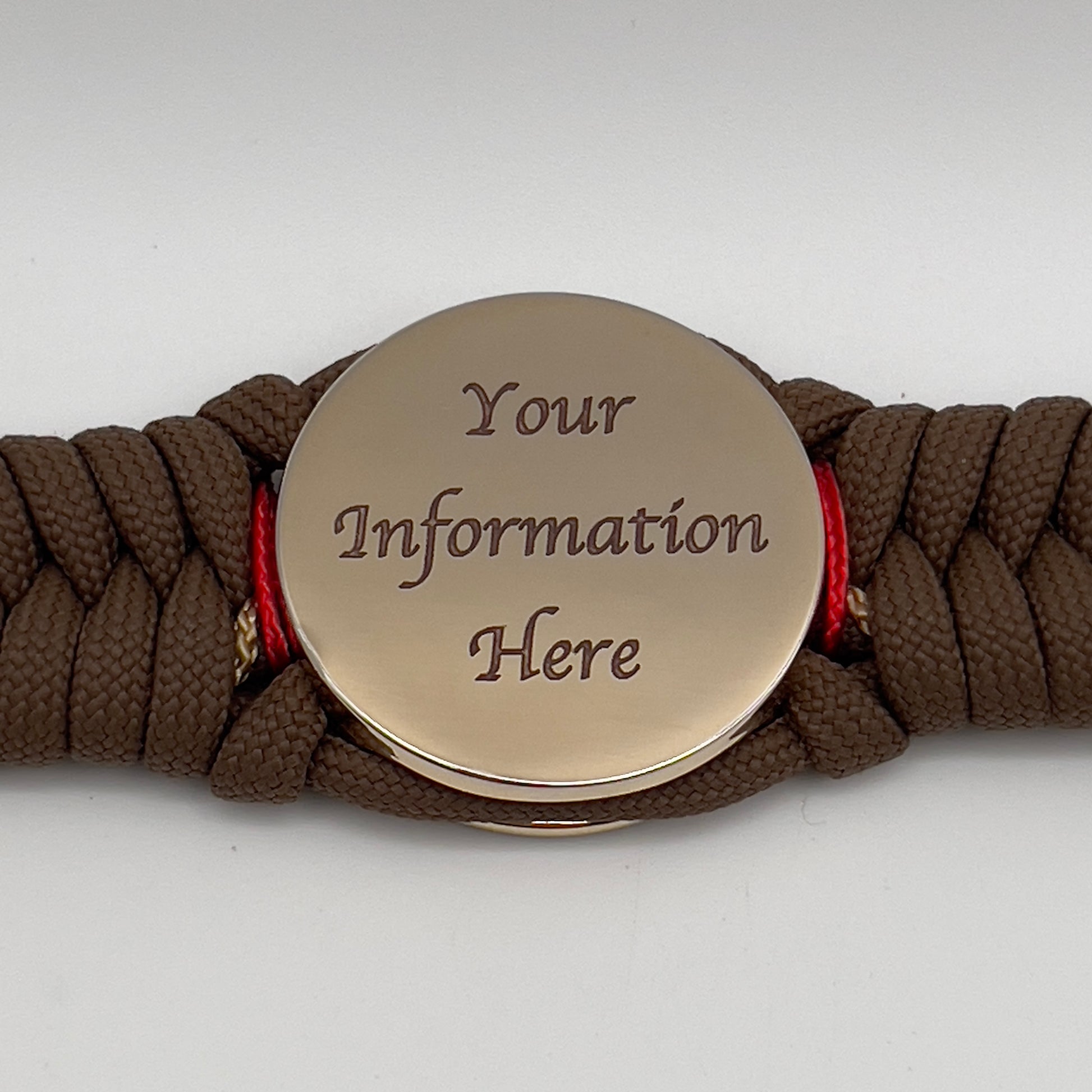 Thick, rigid and comfortable braided United States Marine Corps bracelet featuring a 24K gold plated USMC Eagle Globe and Anchor medallion, a gold Cobra style tactical buckle and woven with Coyote Brown 550 paracord and Imperial Red and gold micro cord.