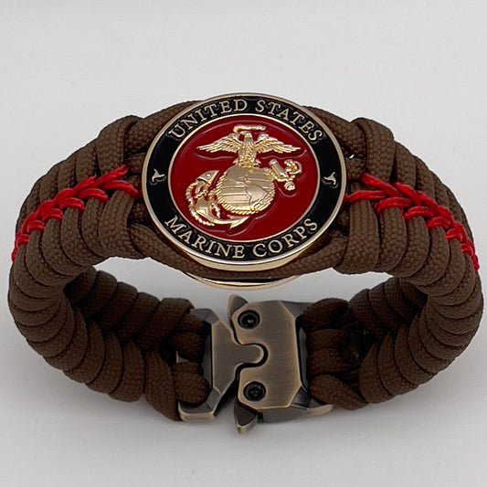Thick, rigid and comfortable braided United States Marine Corps bracelet featuring a 24K gold plated USMC Eagle Globe and Anchor medallion, a gold Cobra style tactical buckle and woven with Coyote Brown 550 paracord and Imperial Red micro cord.