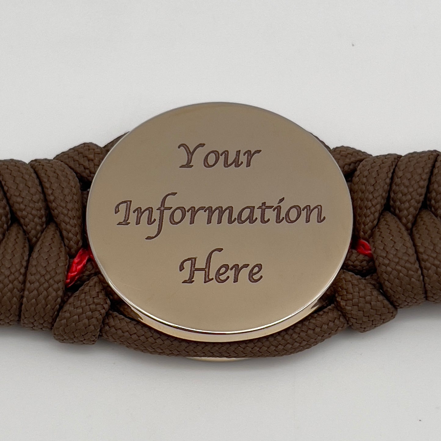 Thick, rigid and comfortable braided United States Marine Corps bracelet featuring a 24K gold plated USMC Eagle Globe and Anchor medallion, a gold Cobra style tactical buckle and woven with Coyote Brown 550 paracord and Imperial Red micro cord.