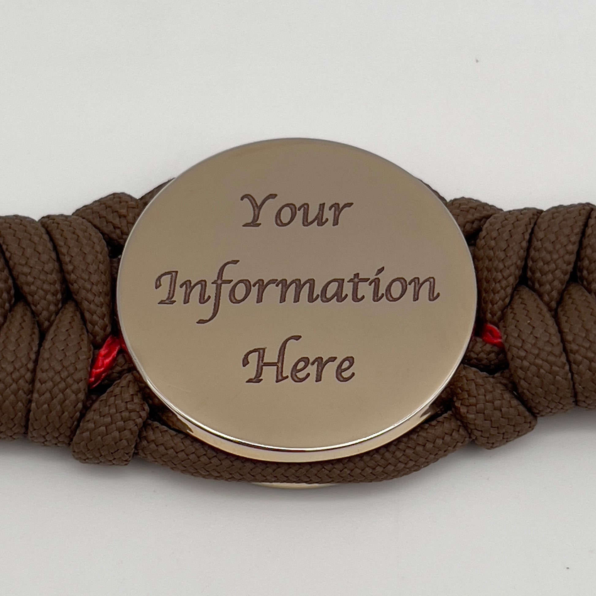 Thick, rigid and comfortable braided United States Marine Corps bracelet featuring a 24K gold plated USMC Eagle Globe and Anchor medallion, a gold Cobra style tactical buckle and woven with Coyote Brown 550 paracord and Imperial Red micro cord.