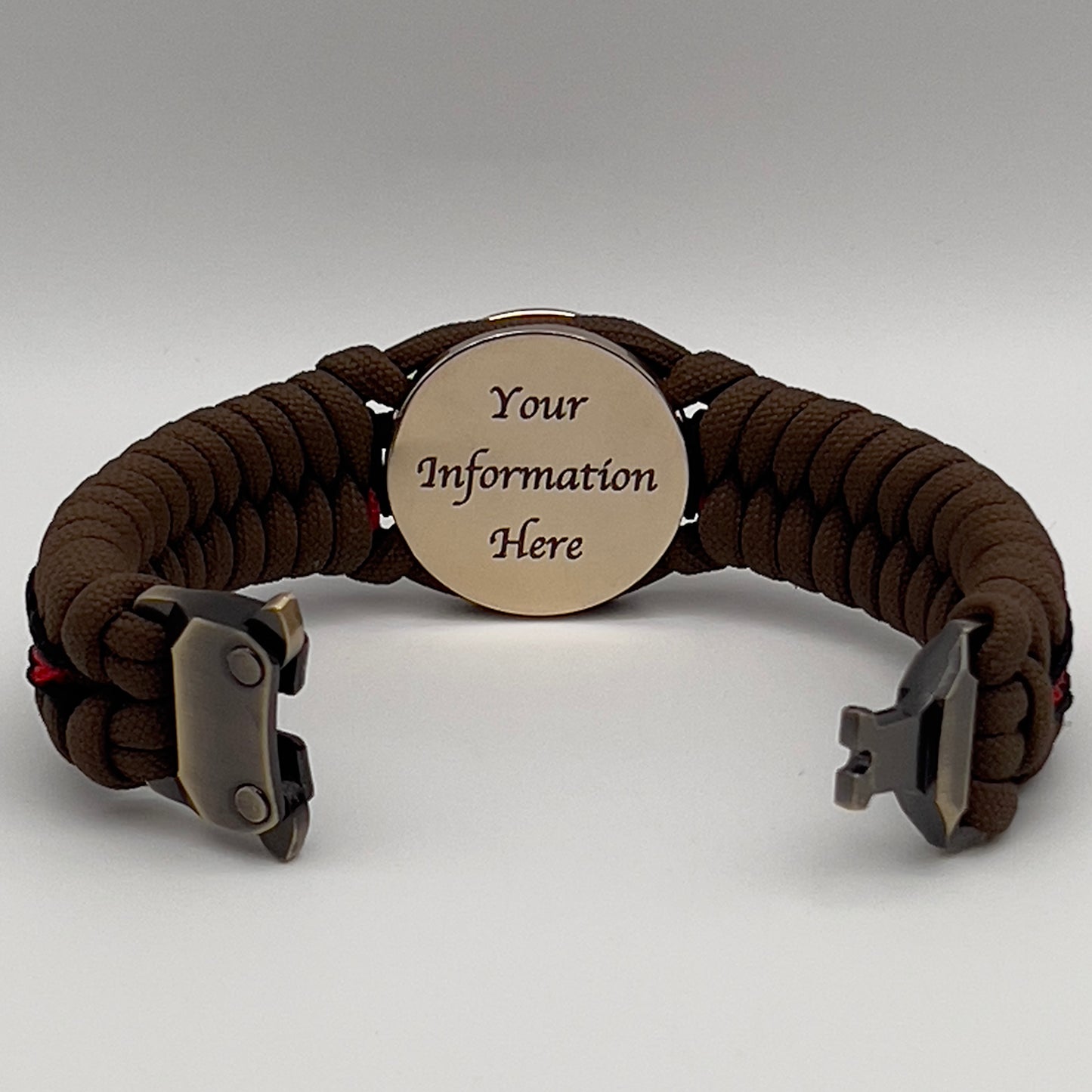 Thick, rigid and comfortable braided United States Marine Corps bracelet featuring a 24K gold plated USMC Eagle Globe and Anchor medallion, a gold Cobra style tactical buckle and woven with Coyote Brown 550 paracord and Imperial Red and black micro cord.