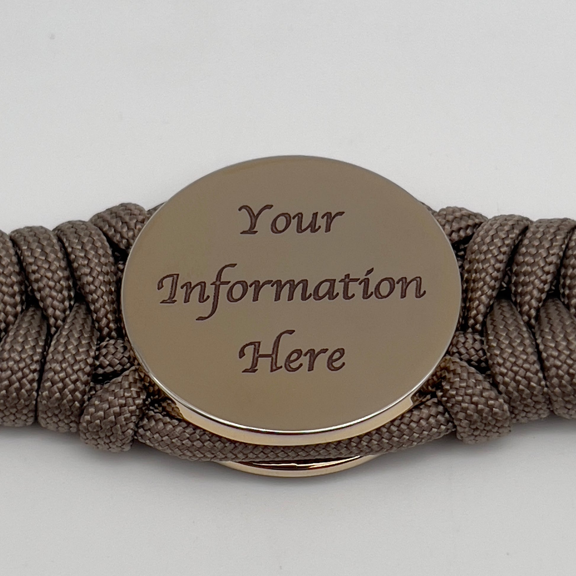 Thick, semi-rigid and comfortable braided United States Marine Corps bracelet featuring a 24K gold plated USMC Eagle Globe and Anchor medallion, a gold Cobra style tactical buckle and woven with tan 550 paracord.