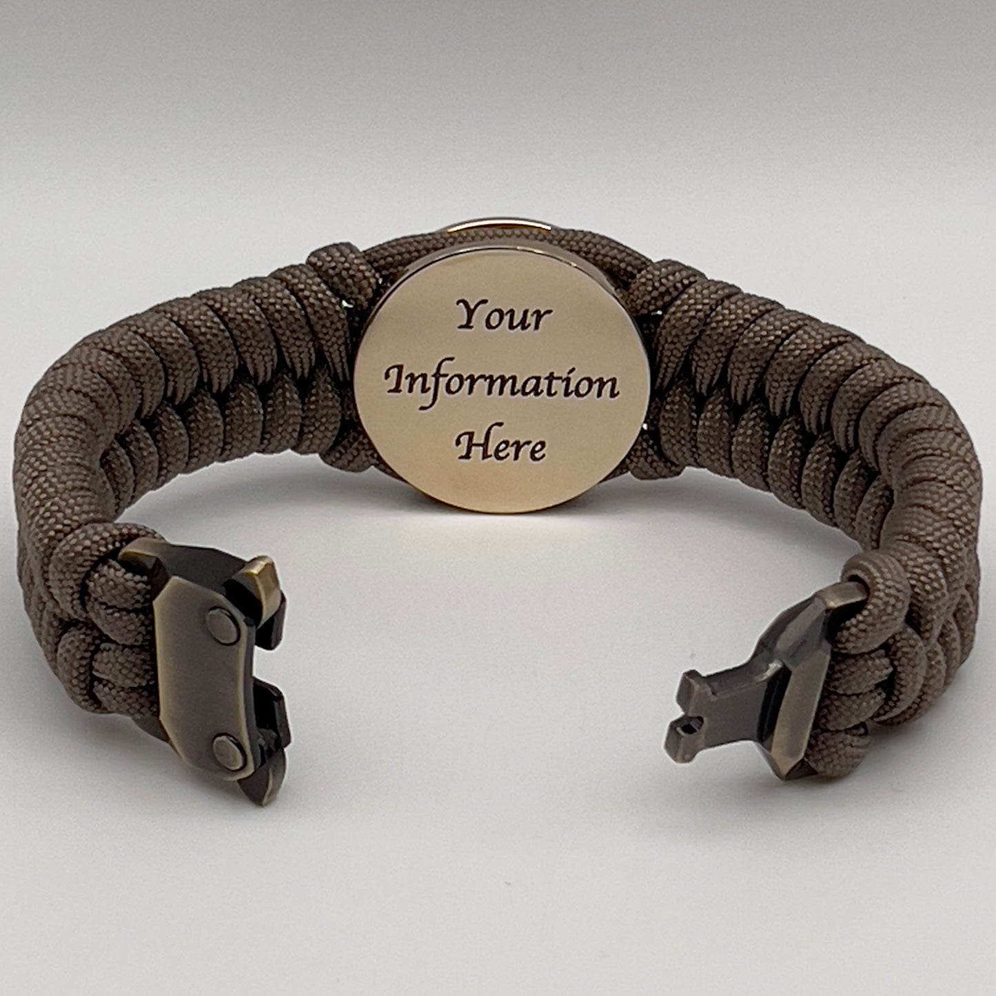 Thick, semi-rigid and comfortable braided United States Marine Corps bracelet featuring a 24K gold plated USMC Eagle Globe and Anchor medallion, a gold Cobra style tactical buckle and woven with tan 550 paracord.