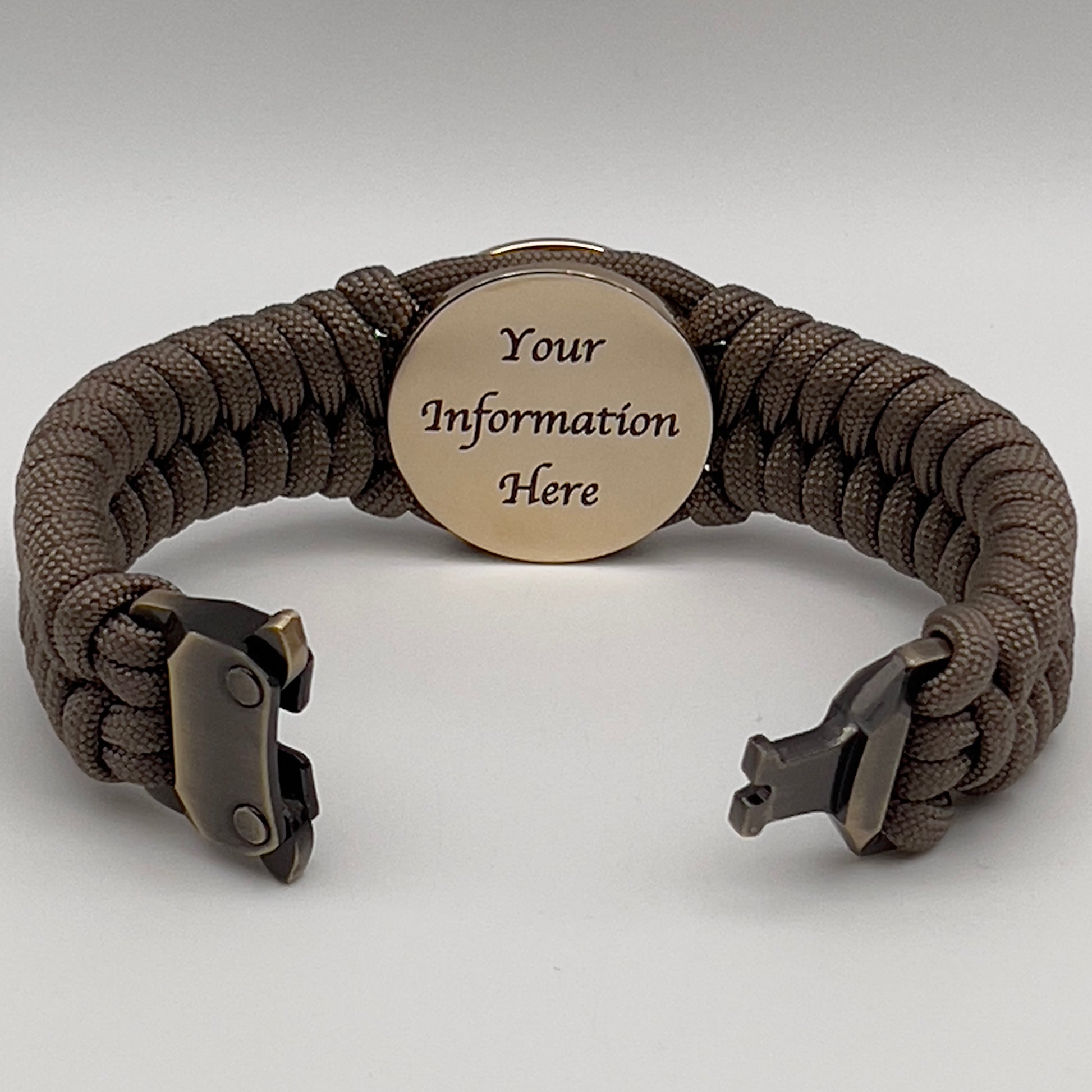 Thick, semi-rigid and comfortable braided United States Marine Corps bracelet featuring a 24K gold plated USMC Eagle Globe and Anchor medallion, a gold Cobra style tactical buckle and woven with tan 550 paracord.