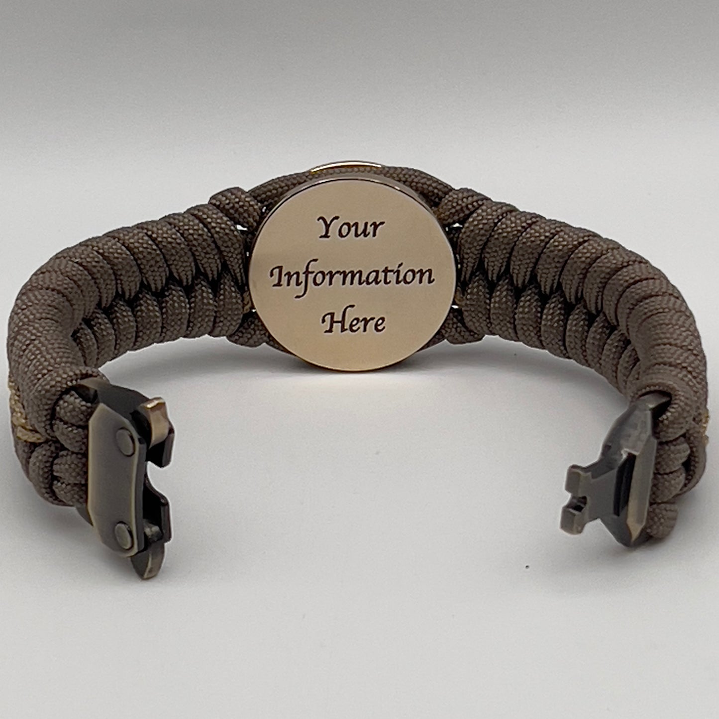 Thick, semi-rigid and comfortable braided United States Marine Corps bracelet featuring a 24K gold plated USMC Eagle Globe and Anchor medallion, a gold Cobra style tactical buckle and woven with tan 550 paracord and gold micro cord.