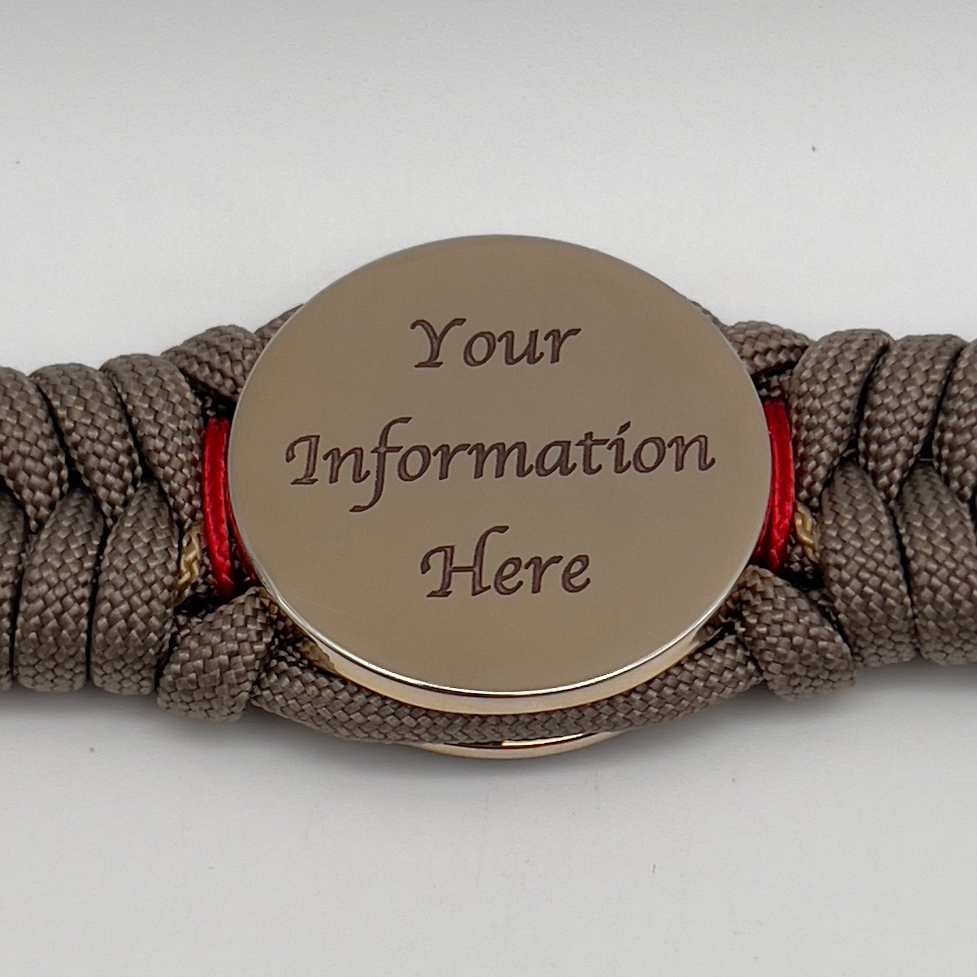 Thick, rigid and comfortable braided United States Marine Corps bracelet featuring a 24K gold plated USMC Eagle Globe and Anchor medallion, a gold Cobra style tactical buckle and woven with tan 550 paracord and Imperial Red and gold micro cord.