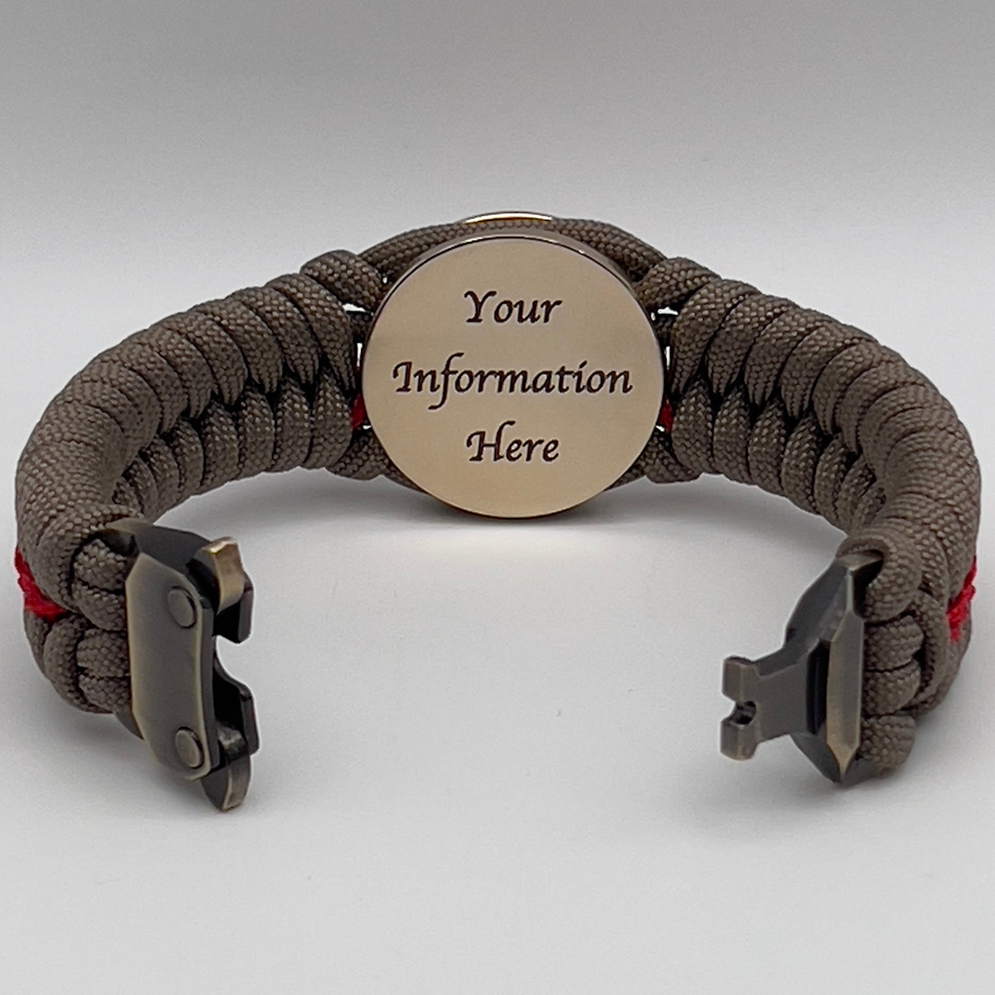 Thick, rigid and comfortable braided United States Marine Corps bracelet featuring a 24K gold plated USMC Eagle Globe and Anchor medallion, a gold Cobra style tactical buckle and woven with tan 550 paracord and Imperial Red micro cord.