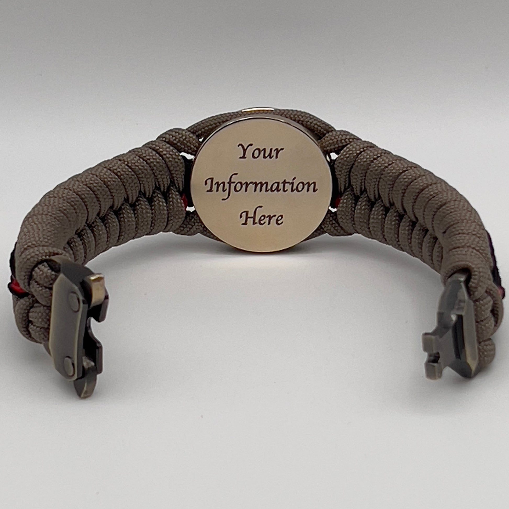 Thick, rigid and comfortable braided United States Marine Corps bracelet featuring a 24K gold plated USMC Eagle Globe and Anchor medallion, a gold Cobra style tactical buckle and woven with tan 550 paracord and Imperial Red and black micro cord.