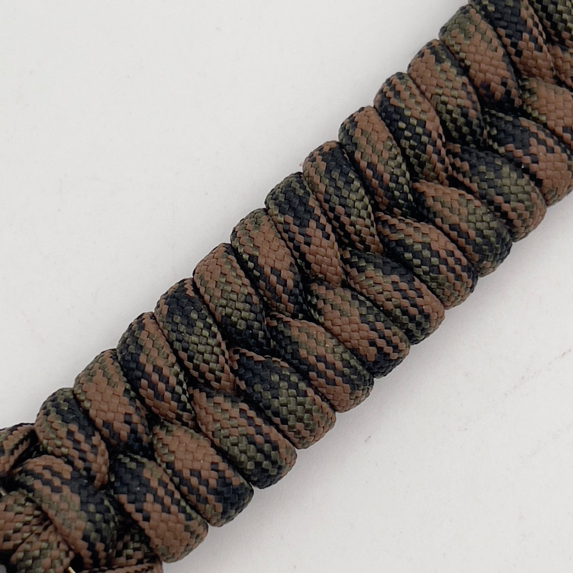 Thick, semi-rigid and comfortable braided United States Marine Corps bracelet featuring a 24K gold plated USMC Eagle Globe and Anchor medallion, a gold Cobra style tactical buckle and woven with Woodland camo 550 paracord.