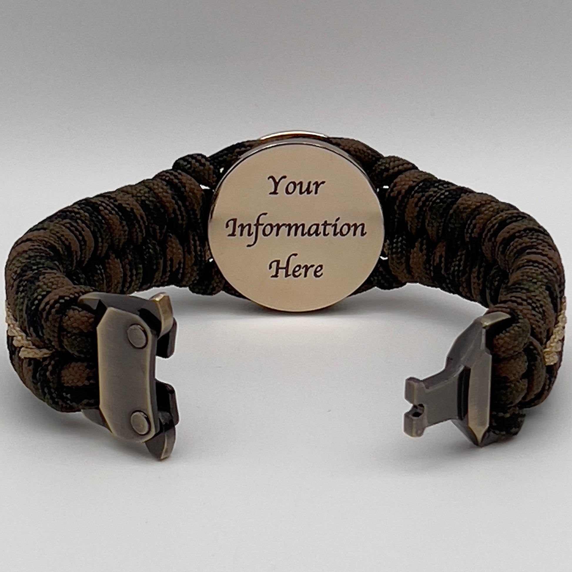 Thick, rigid and comfortable braided United States Marine Corps bracelet featuring a 24K gold plated USMC Eagle Globe and Anchor medallion, a gold Cobra style tactical buckle and woven with Woodland 550 paracord.