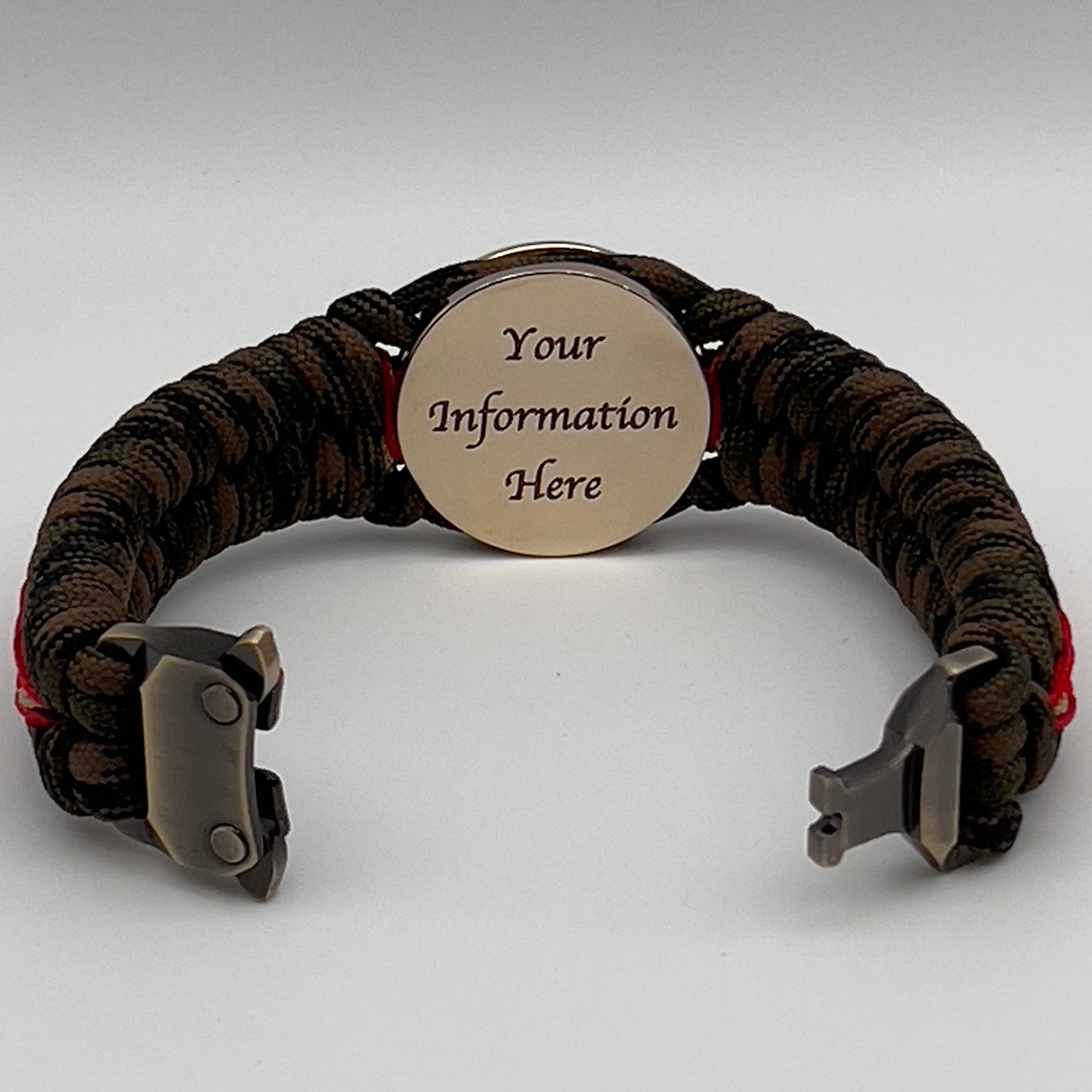 Thick, rigid and comfortable braided United States Marine Corps bracelet featuring a 24K gold plated USMC Eagle Globe and Anchor medallion, a gold Cobra style tactical buckle and woven with Woodland camo 550 paracord and Imperial Red and Gold micro cord.