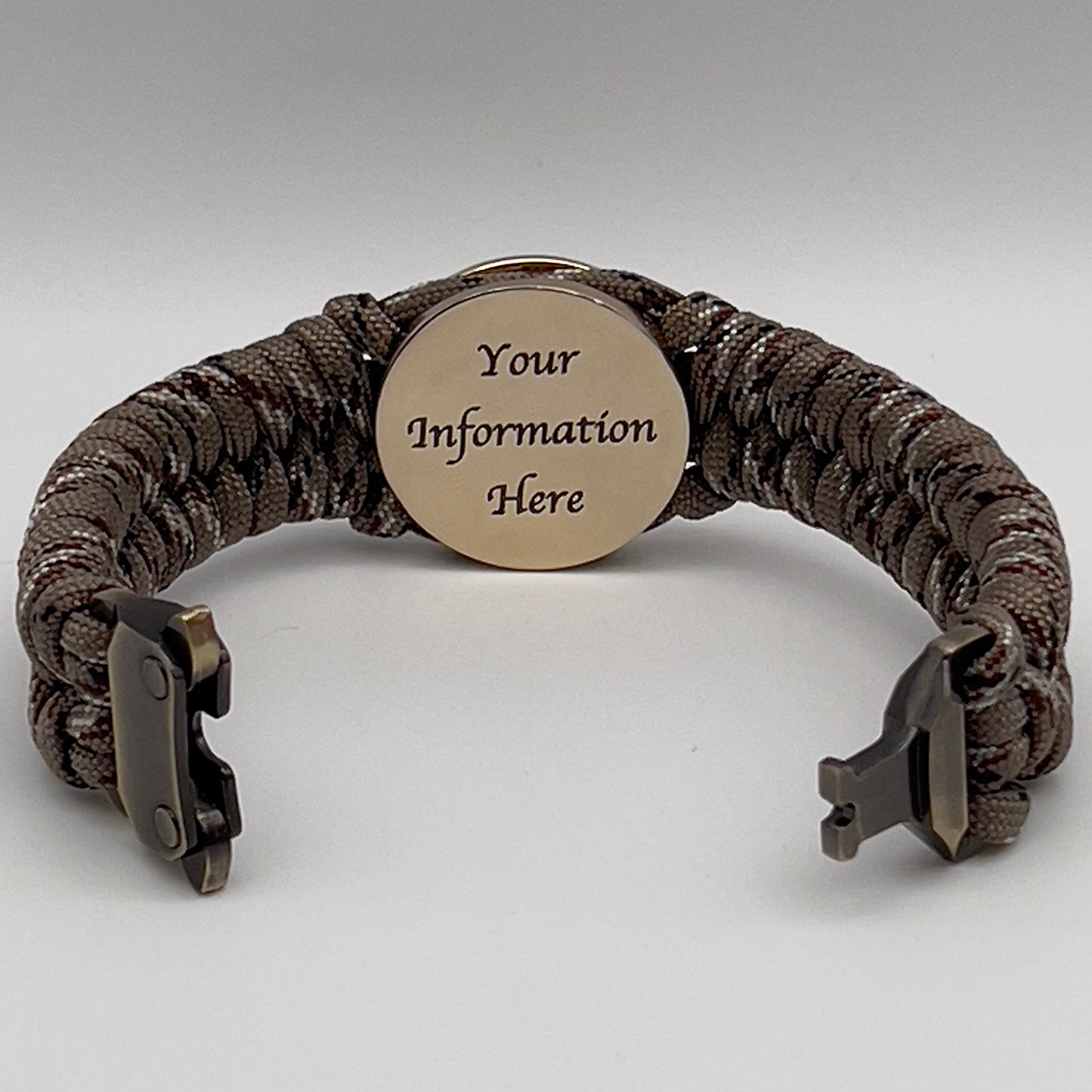 Thick, semi-rigid and comfortable braided United States Marine Corps bracelet featuring a 24K gold plated USMC Eagle Globe and Anchor medallion, a gold Cobra style tactical buckle and woven with Desert Camo 550 paracord.