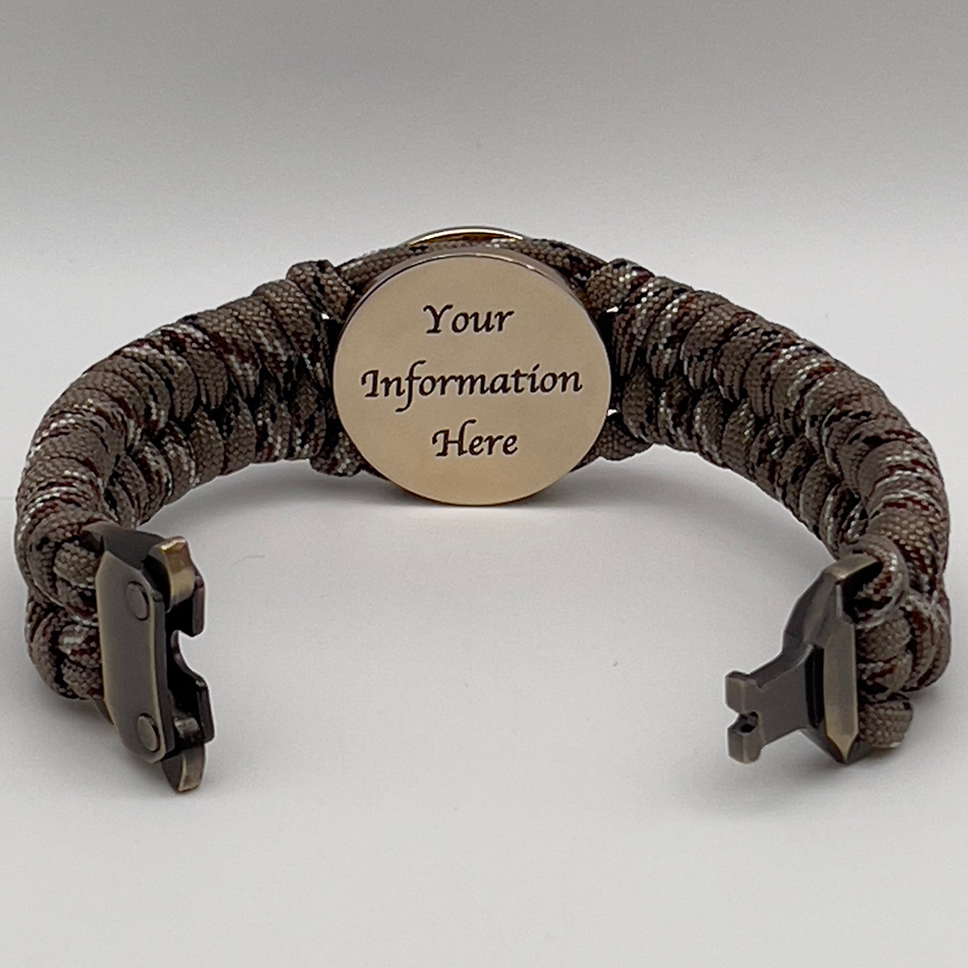 Thick, semi-rigid and comfortable braided United States Marine Corps bracelet featuring a 24K gold plated USMC Eagle Globe and Anchor medallion, a gold Cobra style tactical buckle and woven with Desert Camo 550 paracord.
