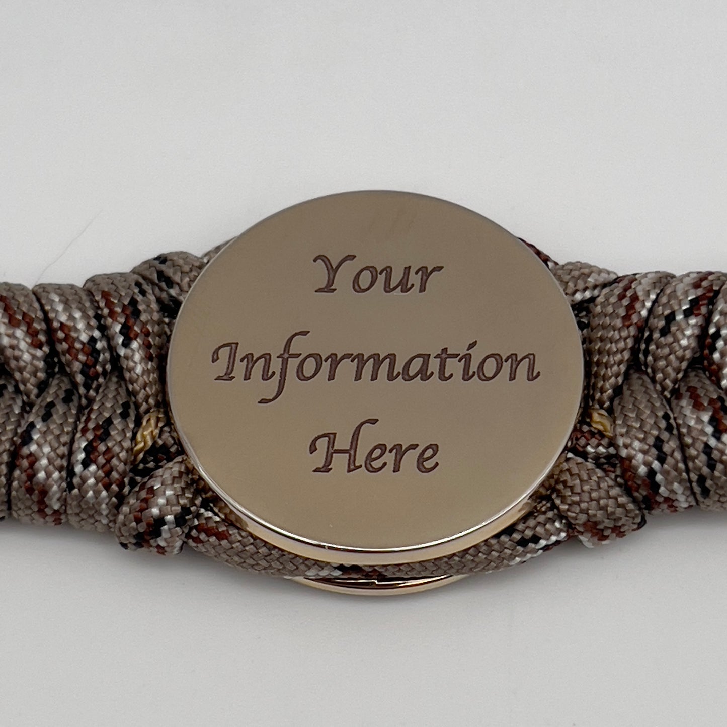Thick, rigid and comfortable braided United States Marine Corps bracelet featuring a 24K gold plated USMC Eagle Globe and Anchor medallion, a gold Cobra style tactical buckle and woven with Desert Camo 550 paracord.
