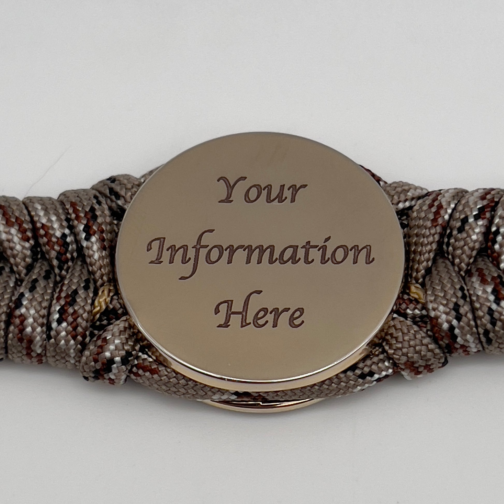 Thick, rigid and comfortable braided United States Marine Corps bracelet featuring a 24K gold plated USMC Eagle Globe and Anchor medallion, a gold Cobra style tactical buckle and woven with Desert Camo 550 paracord.